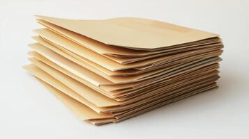 Stacked brown envelopes resting on a clean surface during daylight photo