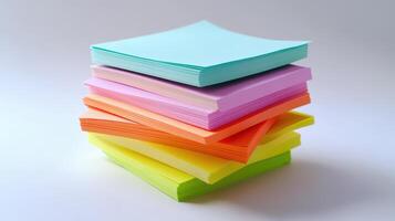 Stack of colorful sticky notes arranged neatly on a white surface in a bright room photo