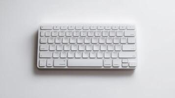 Minimalist white keyboard on a light surface, highlighting its clean design and compact layout photo