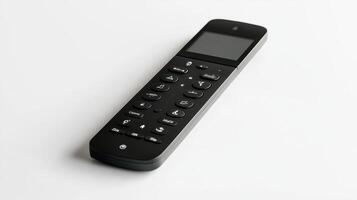Black remote control with buttons placed on a white background photo
