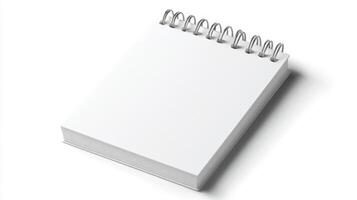 Blank spiral notebook placed on a clean surface, ready for notes or sketches during early morning hours photo