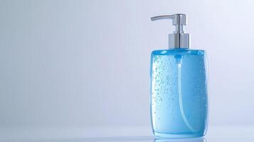 Blue liquid soap dispenser on a clean white surface with bubbles in the gel, captured in a well-lit indoor setting photo