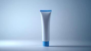 A white cosmetic tube with a blue cap displayed against a soft blue background in a minimalist setting photo