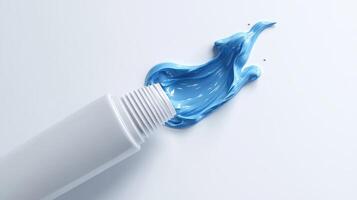 Blue cream emerging from a squeezed white tube on a plain background photo