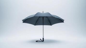 A simple black umbrella stands upright against a plain light background, illustrating its design and structure photo