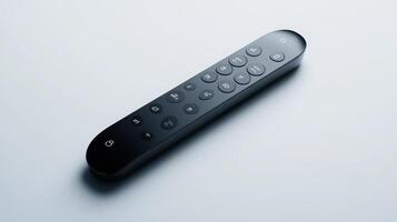 Modern remote control on a smooth surface illuminated by soft light showcasing sleek design features photo