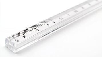 Clear acrylic ruler measuring up to 30 centimeters positioned on a white surface photo