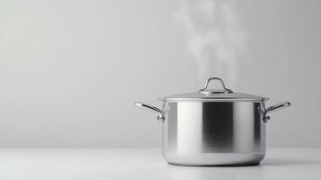 Silver pot on a white countertop with steam rising from it during cooking in a modern kitchen photo