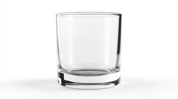 Empty clear glass tumbler on a plain white background, isolated to emphasize its simple design and structure photo