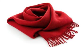 Red wool scarf folded elegantly on a white background with fringed edges photo