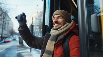 Smiling Man Waving Goodbye While Exiting a City Bus on a Winter Day photo