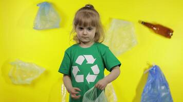 Girl activist makes Earth globe free from plastic package. Reduce trash pollution. Save ecology video