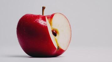 Freshly Sliced Red Apple With Juicy Interior On Minimalist Background photo