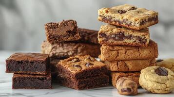 Delicious Assortment of Brownies and Cookies on Marble Countertop Displayed in Bright Natural Light photo