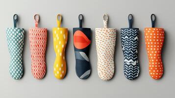 Colorful and Stylish Kitchen Oven Mitts Arranged Neatly on a Light Background photo