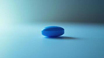 Blue Capsule on a Light Surface Captured in Soft Natural Lighting During Daytime photo