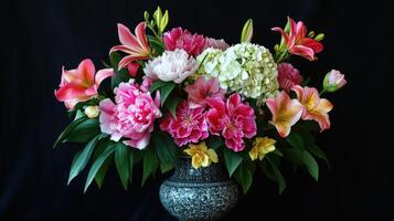 Beautiful Floral Arrangement Featuring Diverse Blooms in Ornate Vase on Black Background photo
