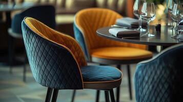 Stylish Modern Restaurant Interior Featuring Colorful Quilted Chairs and Elegant Table Setting photo