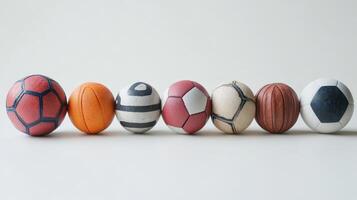 Various Sports Balls Including Soccer, Basketball, and Tennis Arranged Neatly on a Simple Background photo