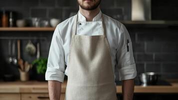 A chef stands confidently in a modern kitchen, wearing an apron and ready to prepare a meal in a cozy, well-equipped culinary environment photo