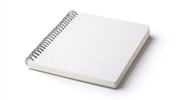 Blank spiral notebook on a white background for creative writing, drawing, or sketching activities photo
