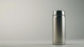 Stainless steel thermos on a minimalistic background with soft lighting photo