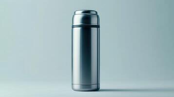 Stainless steel thermos standing upright on a light blue background, showcasing its sleek design and functional features photo