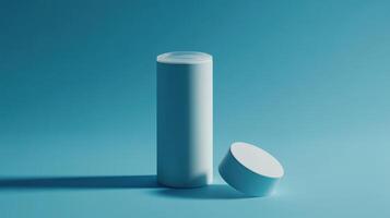 Minimalist cylindrical container on a blue background with a lid partially removed photo
