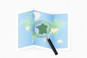 Enlarge France with a magnifying glass on a folded map of the world. vector
