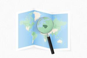 Enlarge Lithuania with a magnifying glass on a folded map of the world. vector