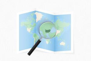 Enlarge Bulgaria with a magnifying glass on a folded map of the world. vector