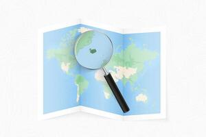 Enlarge Iceland with a magnifying glass on a folded map of the world. vector