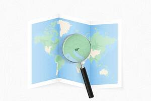 Enlarge Slovenia with a magnifying glass on a folded map of the world. vector