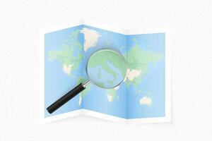 Enlarge Vatican City with a magnifying glass on a folded map of the world. vector