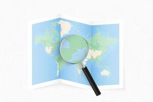 Enlarge Andorra with a magnifying glass on a folded map of the world. vector
