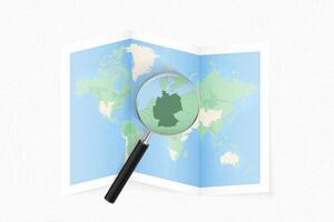 Enlarge Germany with a magnifying glass on a folded map of the world. vector