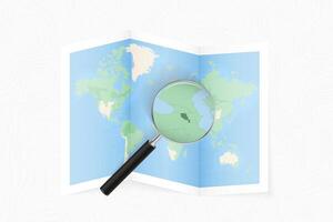Enlarge Armenia with a magnifying glass on a folded map of the world. vector