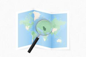 Enlarge Serbia with a magnifying glass on a folded map of the world. vector