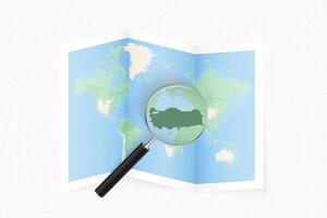 Enlarge Turkey with a magnifying glass on a folded map of the world. vector