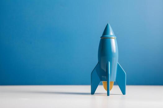 Blue rocket toy on white surface, vibrant background, striking focal point photo