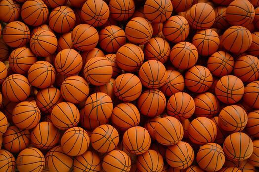 Basketballs densely packed together, creating rich texture and uniformity photo