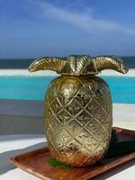 Pineapple juice, a refreshing drink with a sea view. photo