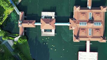 Aerial ascending top down view of spa lake Heviz in Hungary in July 2024 video