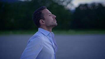 A Thoughtful Man Bathed in the Soft Glow of Evening Light, Lost in Contemplation and Dreams video