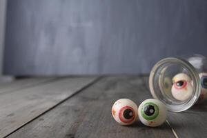 Eyes in a jar close-up on a gray background with space for copyspace text photo