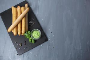 White Natural Healthy Right Sausages Without Dyes With Basil Pesto Pepper On Grey Background With Space For Copy Space Text. Sausage recipe photo