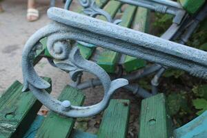 Forged patterns. Metal pattern on bench close-up photo
