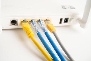 Ethernet cable with wireless router connect to internet service provider internet network. photo