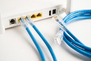 Ethernet cable with wireless router connect to internet service provider internet network. photo