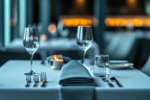 Elegant dining setup with gray linen at dusk photo